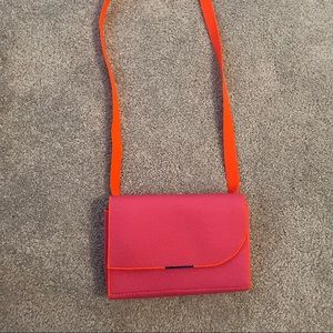 Rothy’s hot pink belt bag